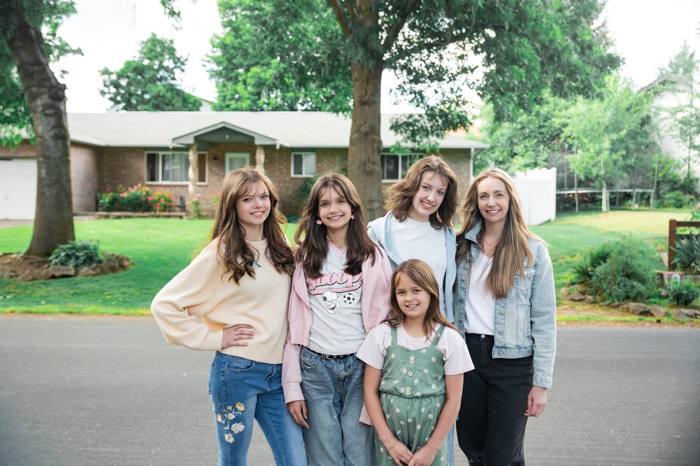 Miss Carrie with her daughters outside the family home